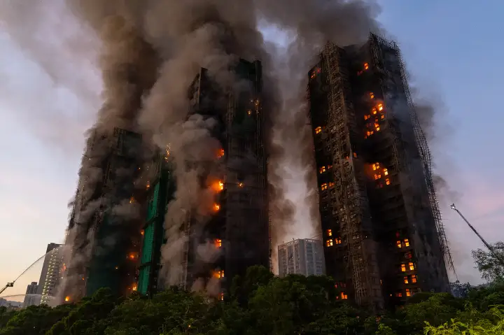 Hong Kong high-rise fire shown engulfing multiple towers with smoke and flames during rescue efforts